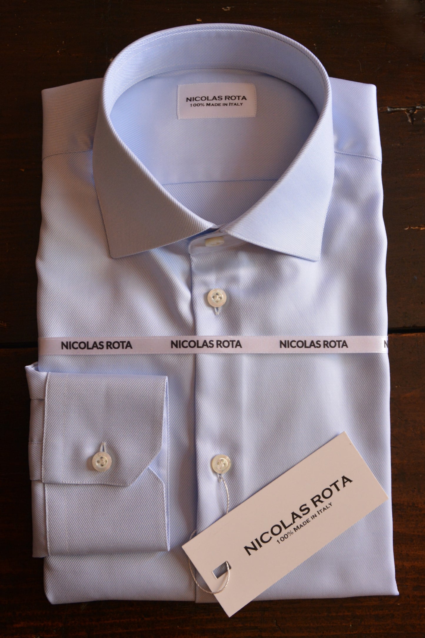 Handcrafted light blue men's shirt in fine soft twill and Australian mother of pearl buttons with logo. Handmade in Italy.