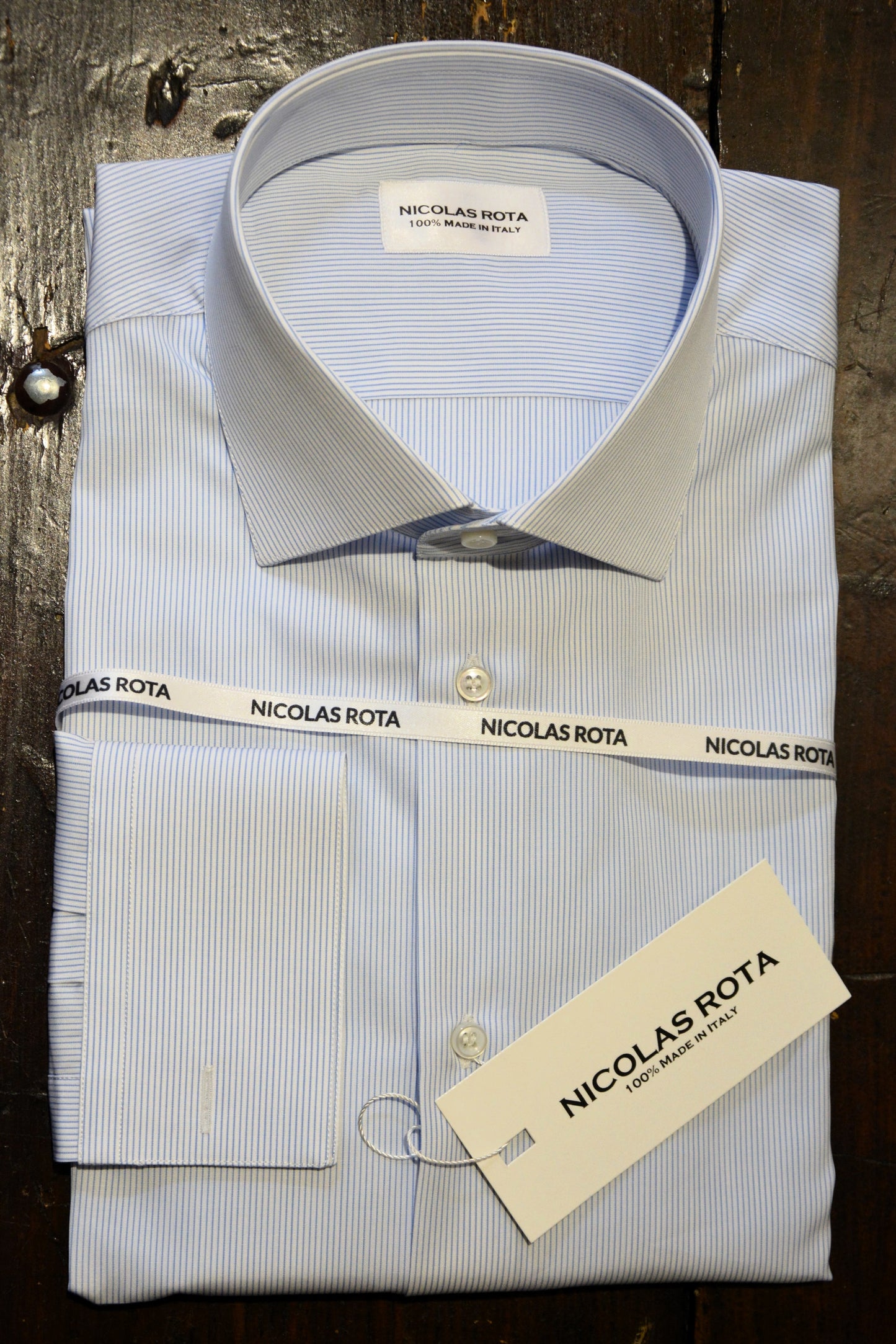 Handcrafted white men's shirt with thin sky blue stripes in fine soft poplin cotton and Australian mother of pearl buttons. Handmade in Italy.