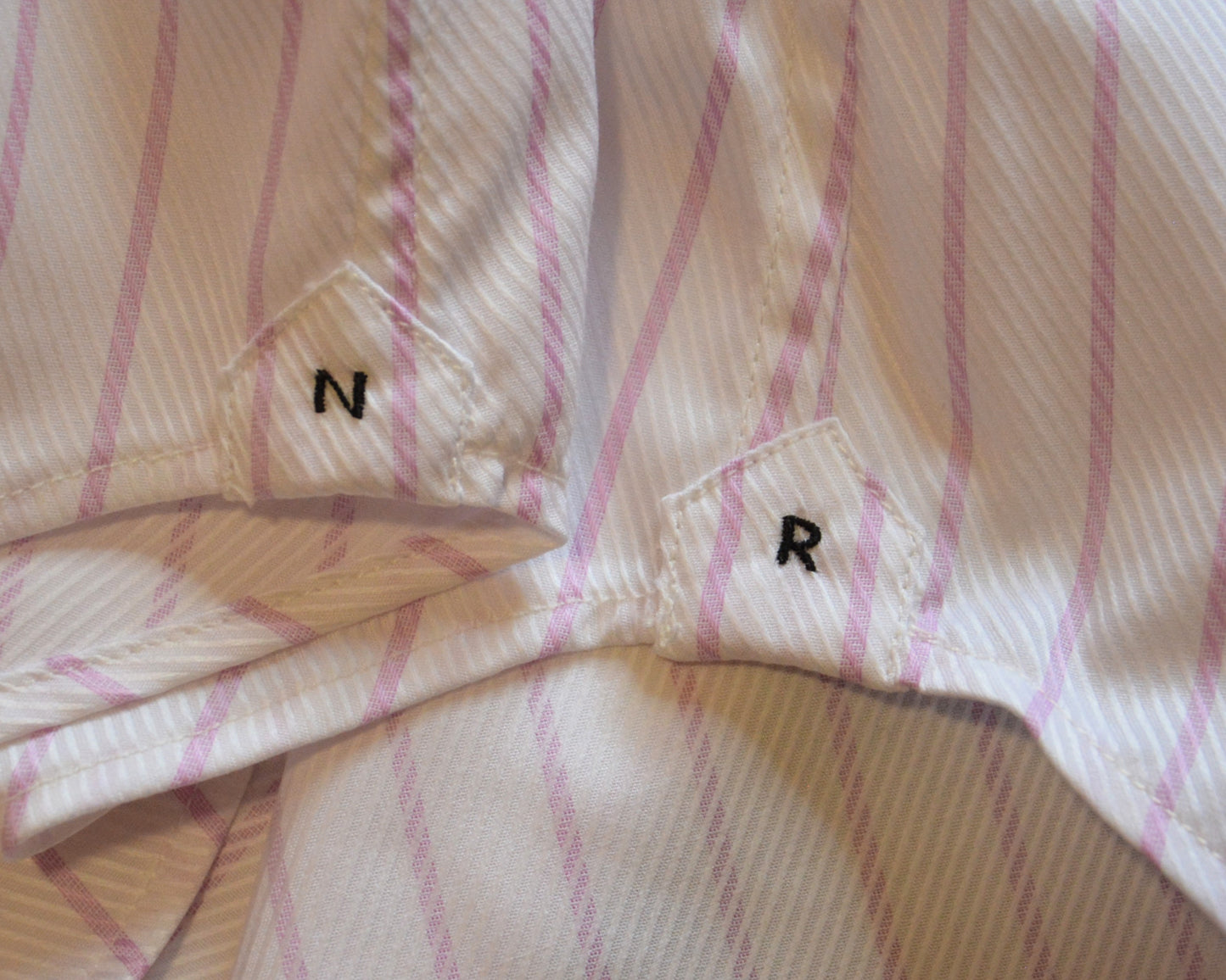 Reinforcement side flies with hand-stitched NR logo.